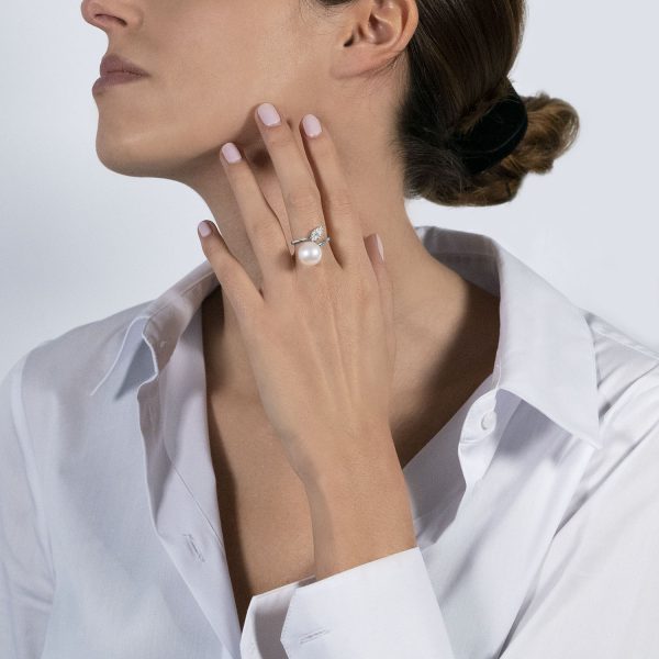 The model wears the my song ring with freshwater pearl and diamonds