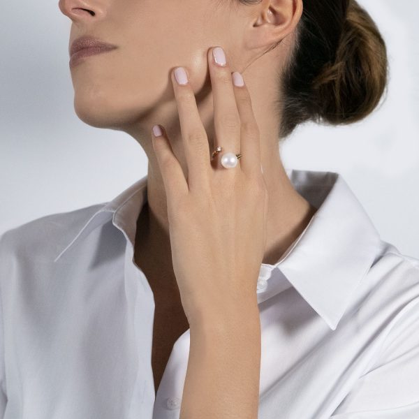 The model wears perlage collection ring with freshwater pearls and diamonds