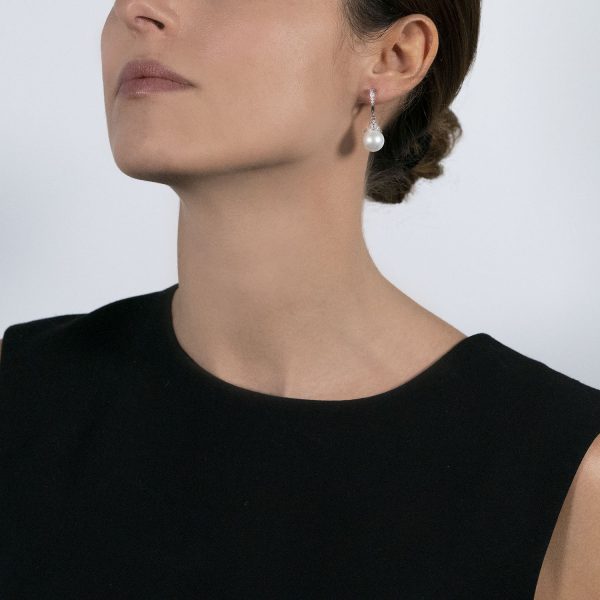 The model wears Stardust collection earrings with south sea pearls and diamonds