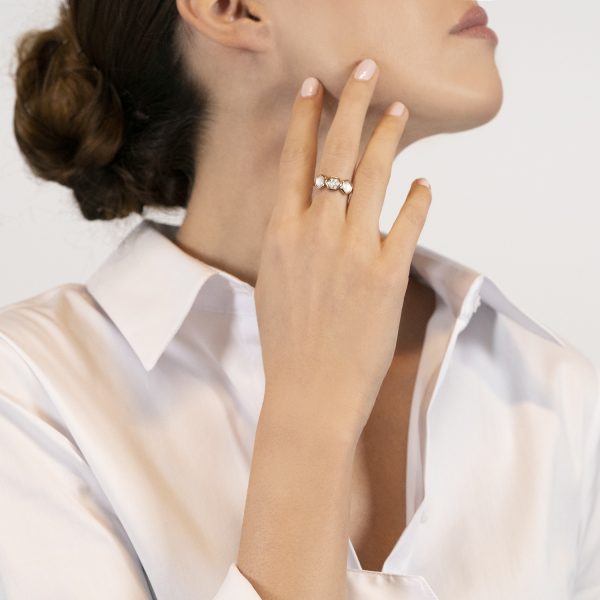 The model wears Venus collection ring with freshwater pearls mother of pearl and diamonds