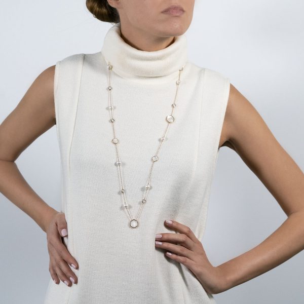 The model wears Venus collection long necklace with freshwater pearls mother of pearl and diamonds