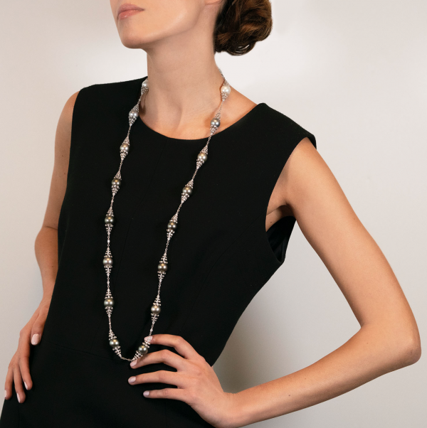 The model wears Notturno collection long necklace with South Sea and Tahiti pearls and diamonds