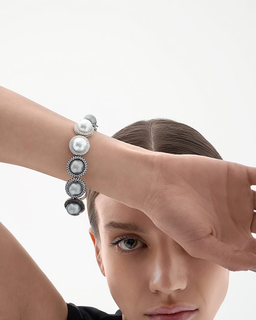 The model wears the unique bracelet with South Sea and Tahiti pearls and diamonds