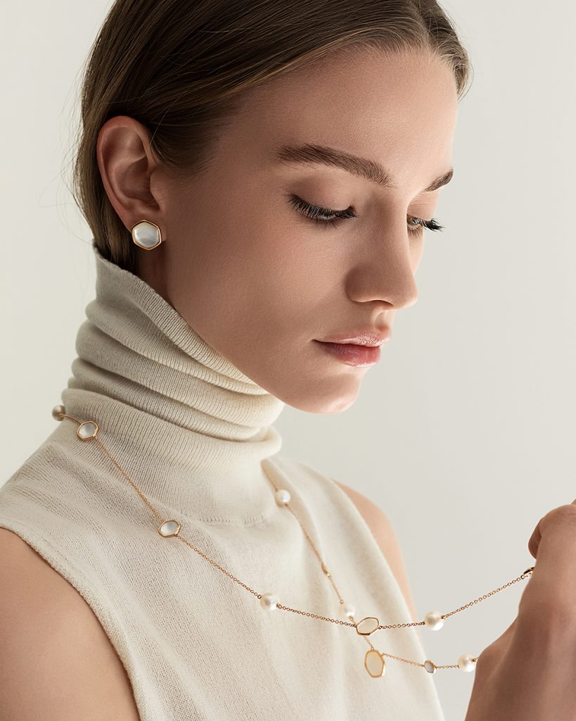 The model wears Venus collection with Freshwater pearls mother of pearl and diamonds